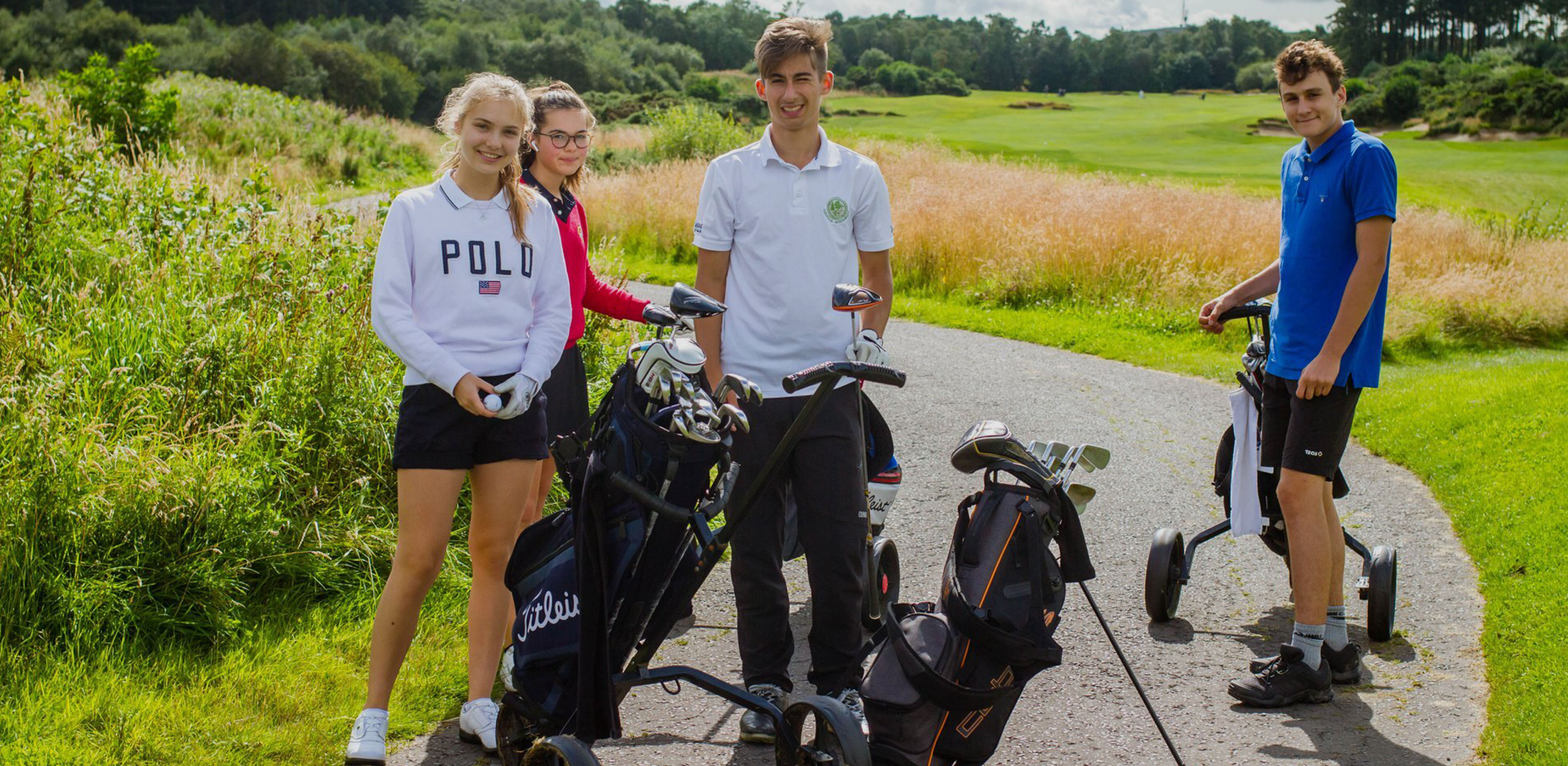 students on a golf course elective
